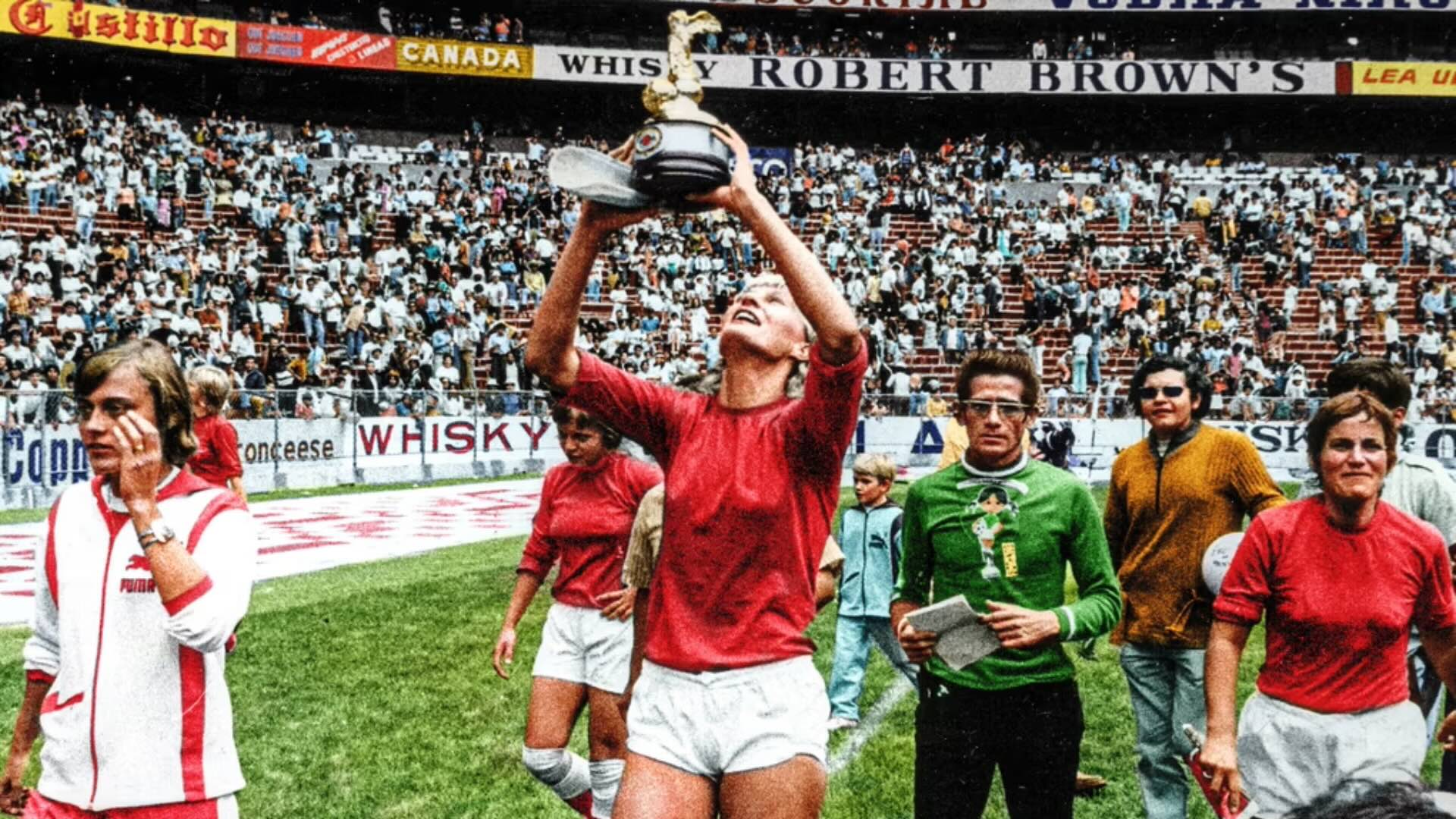 Denmark’s Lis Lene Nielsen holds the trophy after her team beat Mexico 3–0 1971